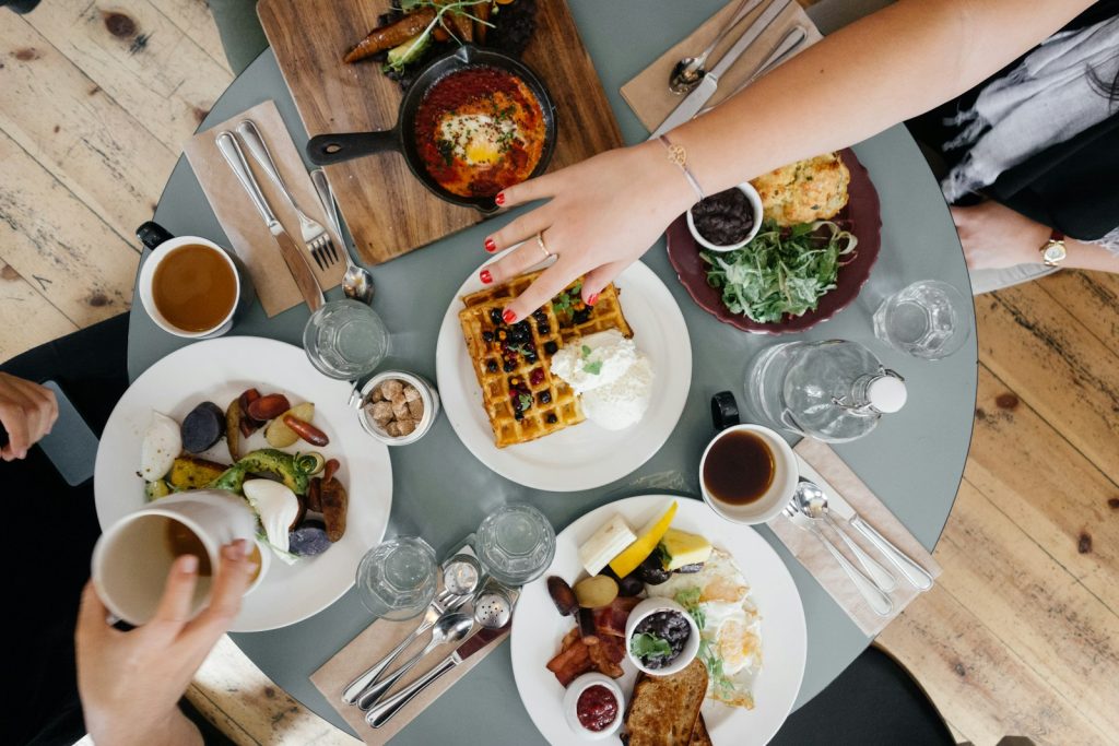 The picture shows the family having a long breakfast on "Sunday in Germany".